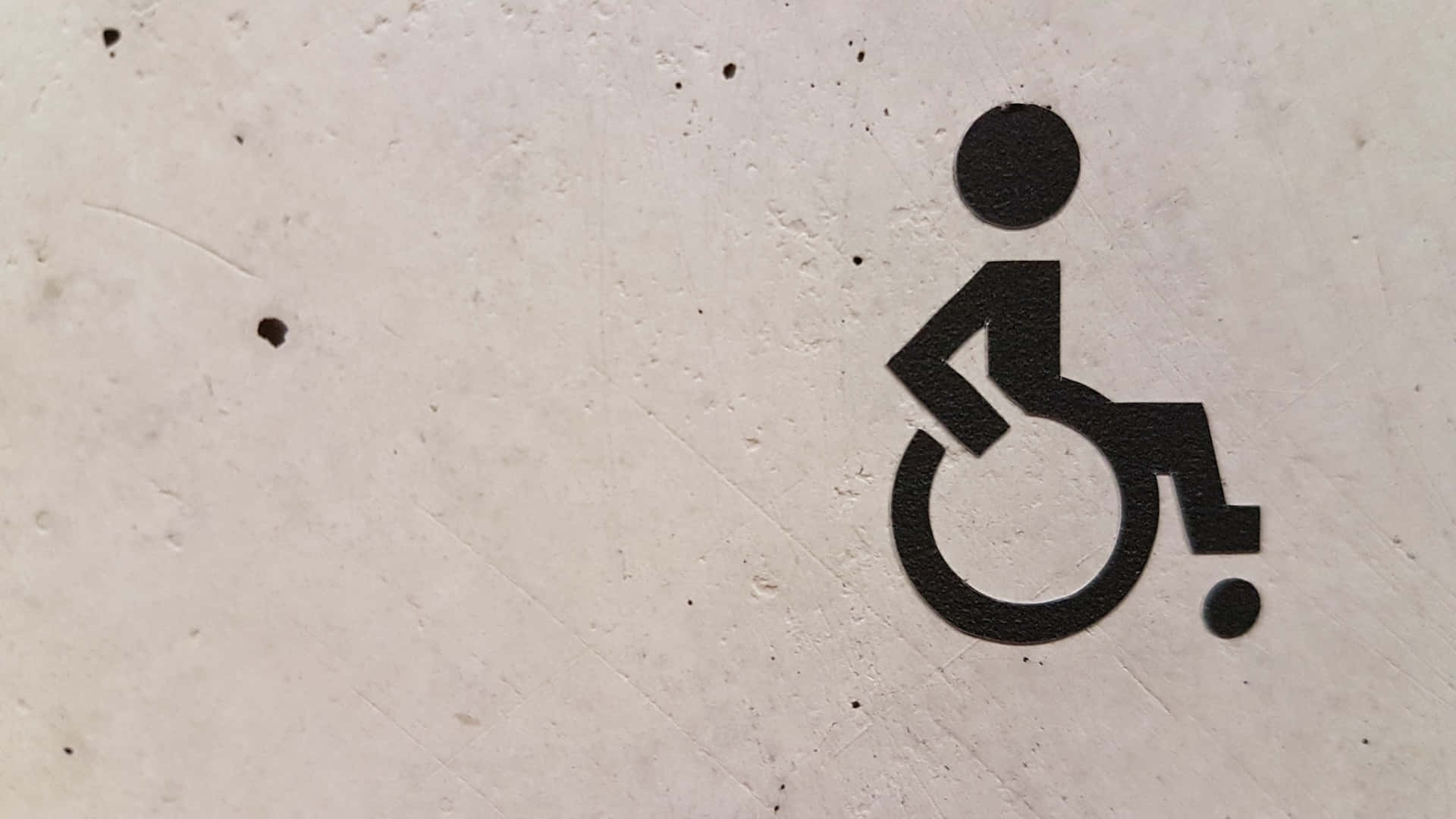 Wheelchair Signageon Concrete Wall Wallpaper