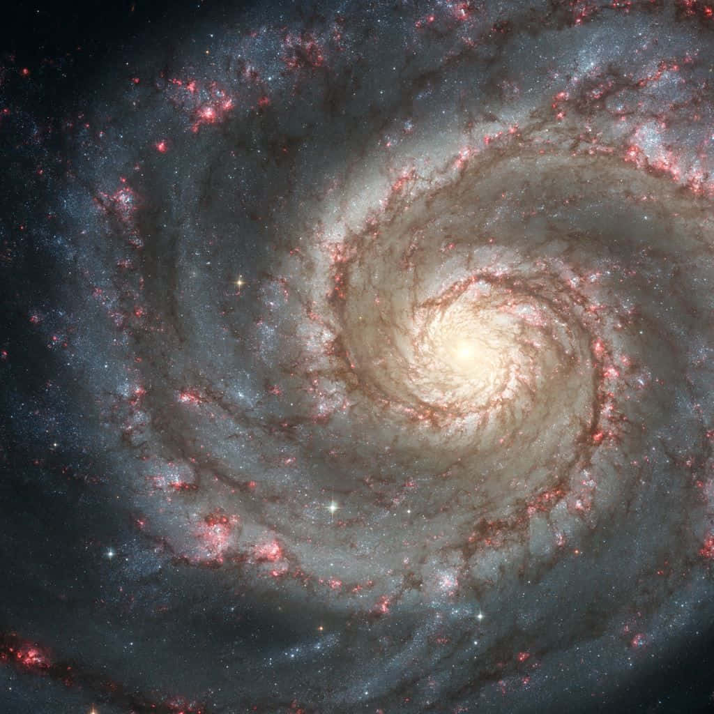 Majestic Whirlpool Galaxy in the Night Sky Wallpaper