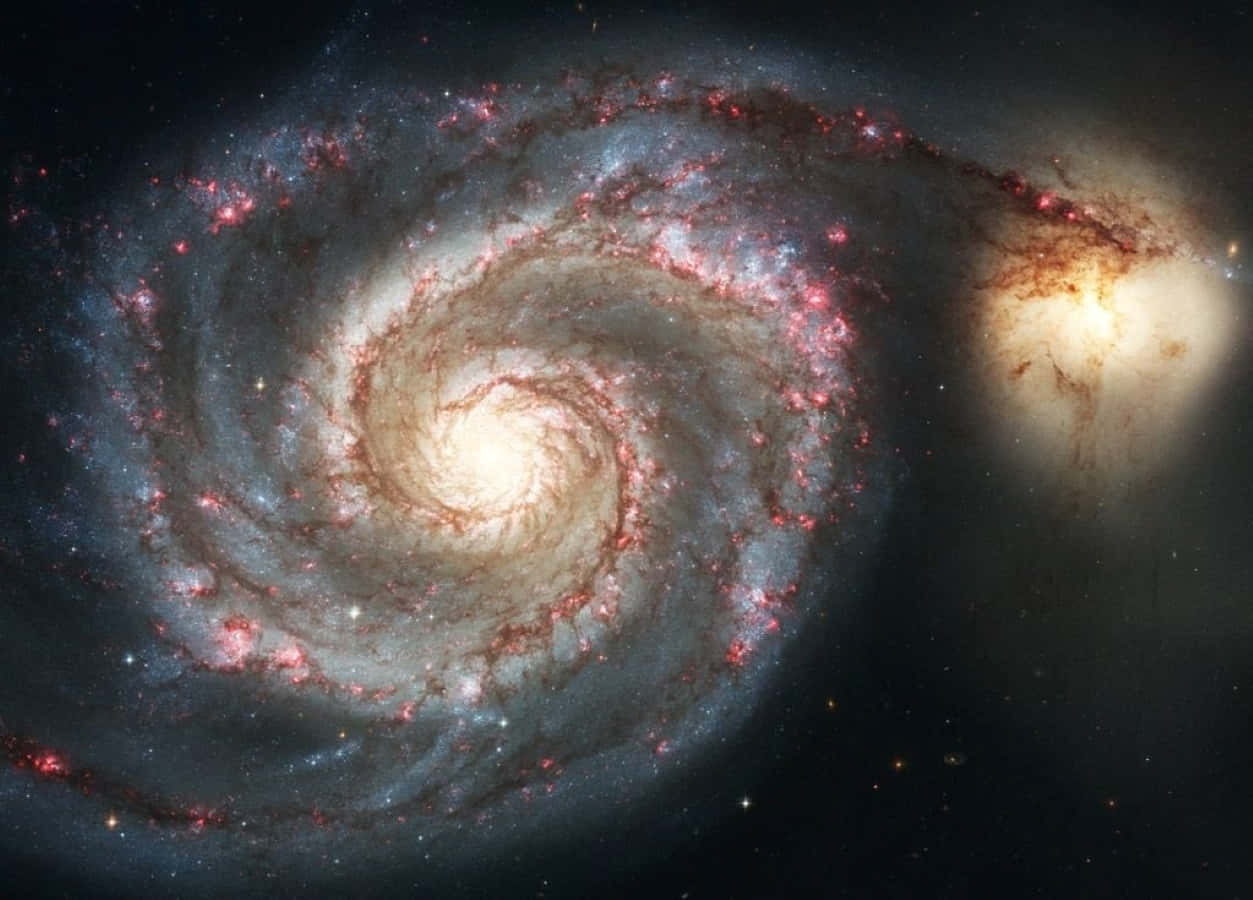 Majestic Whirlpool Galaxy in the Night Sky Wallpaper