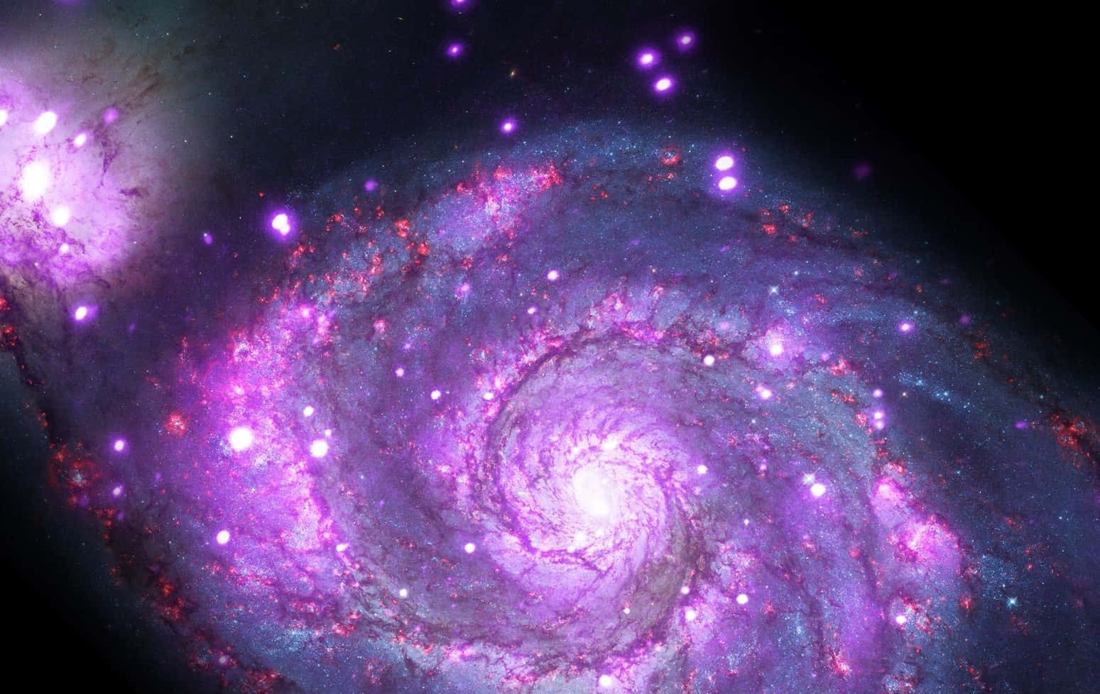 A mesmerizing view of the Whirlpool Galaxy Wallpaper
