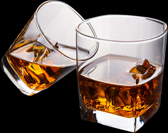 Whiskey Glasses Tilted With Ice PNG