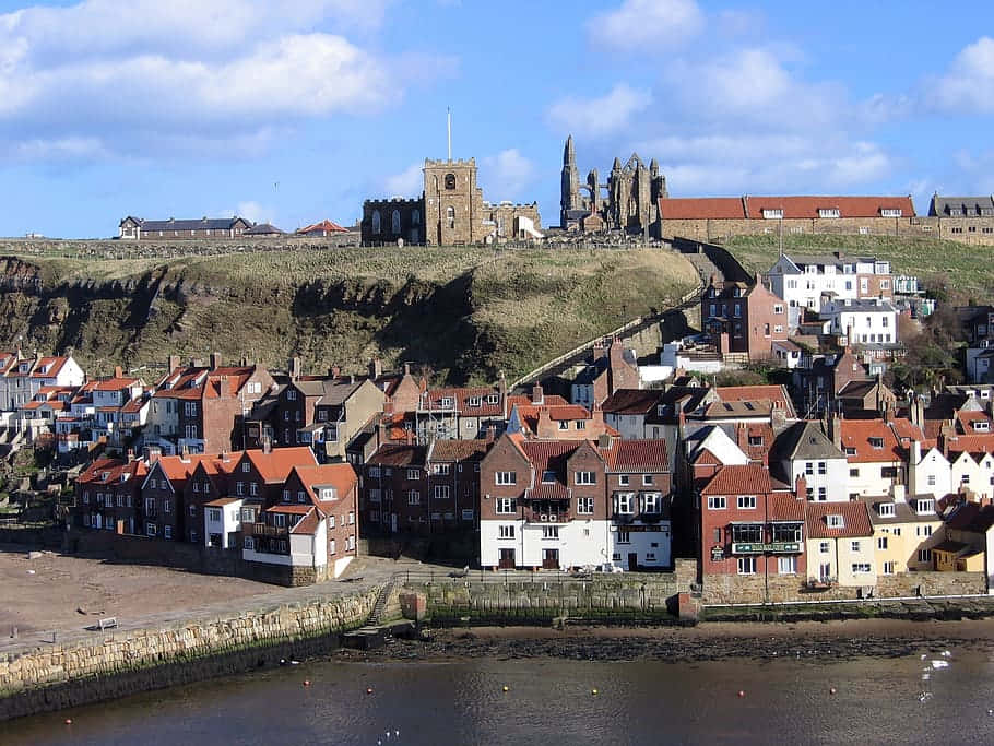 Whitby Abbey Overlooking Houses Wallpaper