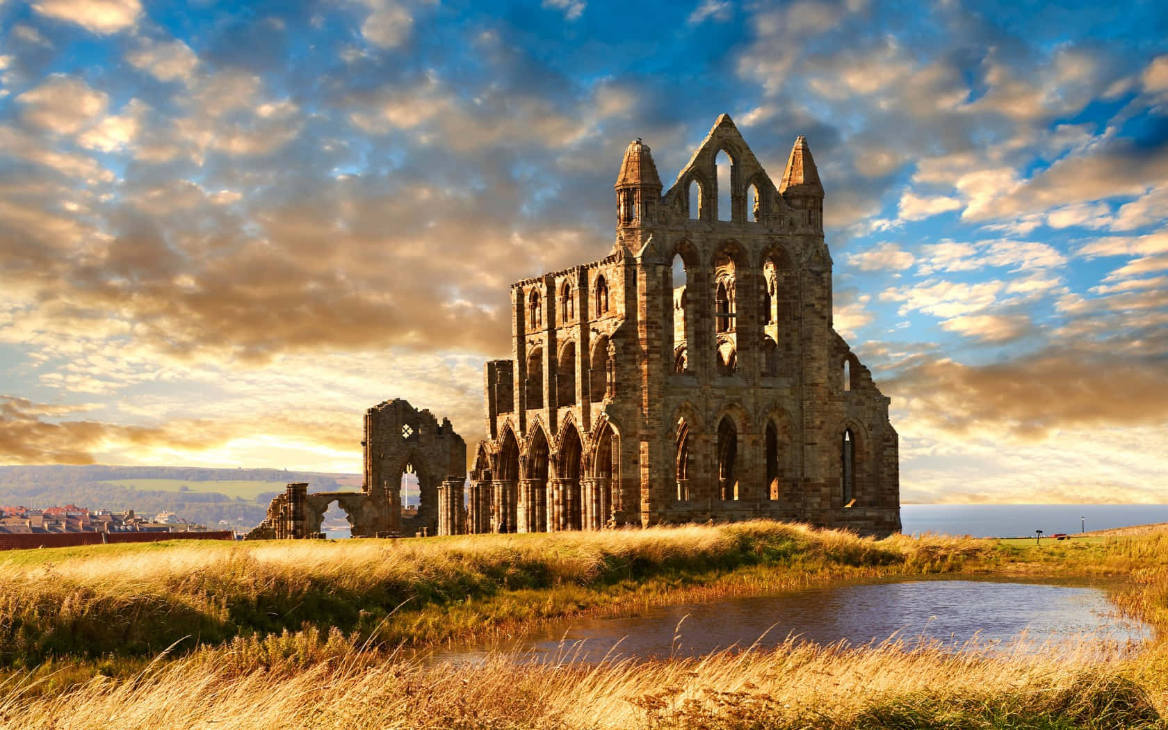 Download Whitby Abbey Sunset Glow Wallpaper | Wallpapers.com