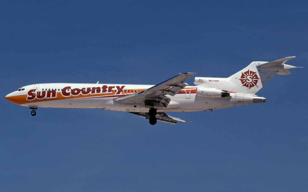 White Aircraft Of Sun Country Wallpaper