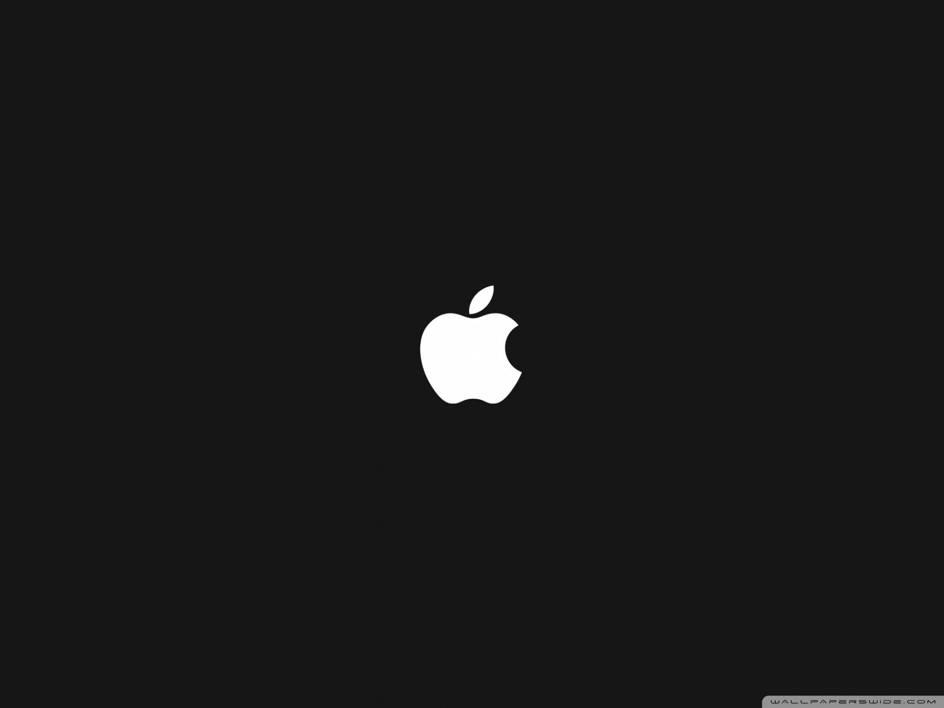 The classic Apple logo in white on a black background Wallpaper