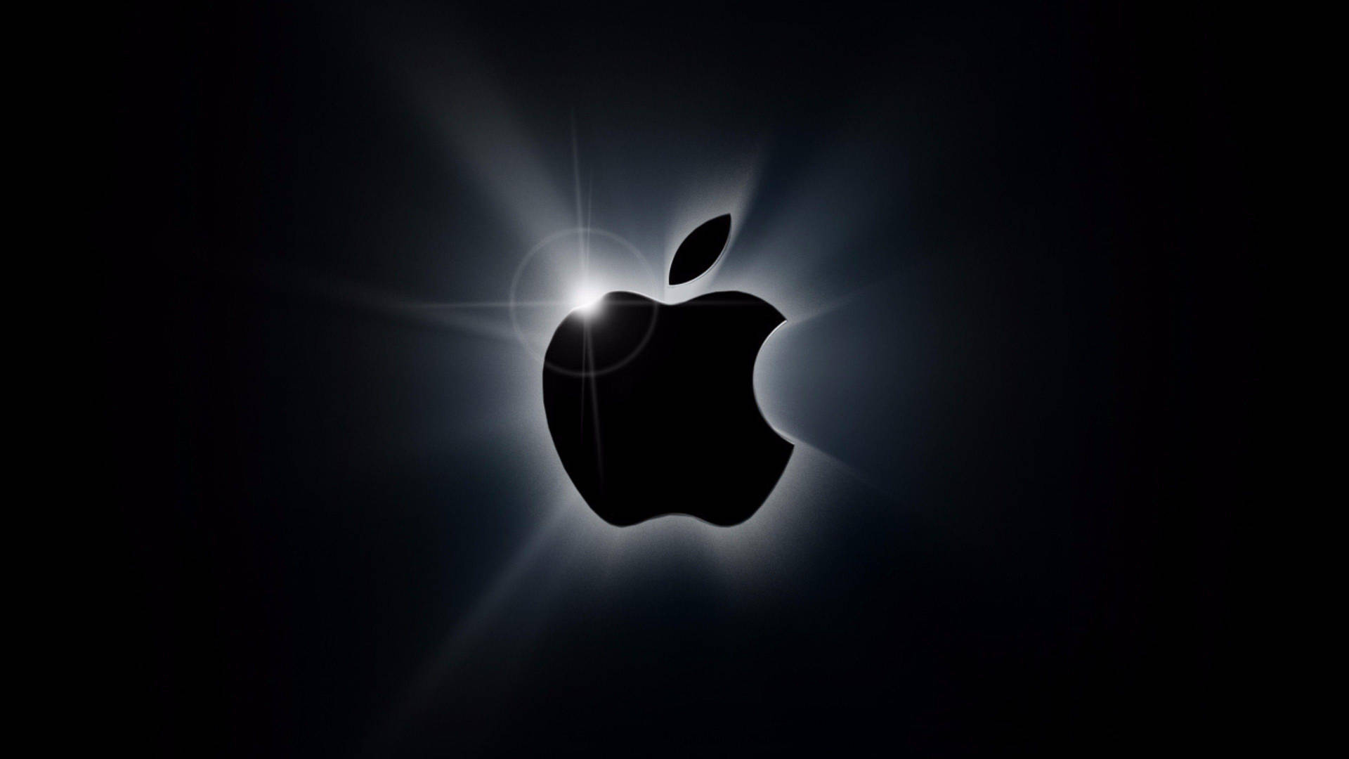 Caption: Stunning Backlit Apple Logo in 4K Wallpaper