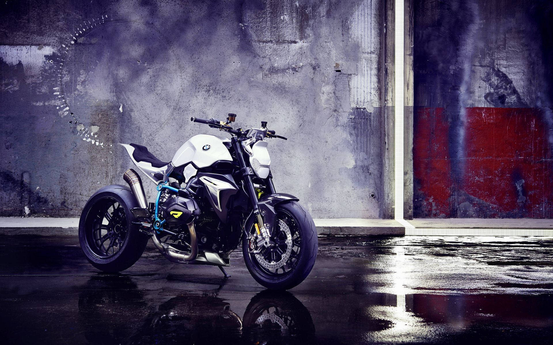 White BMW Motorcycle sitting in a garage Wallpaper