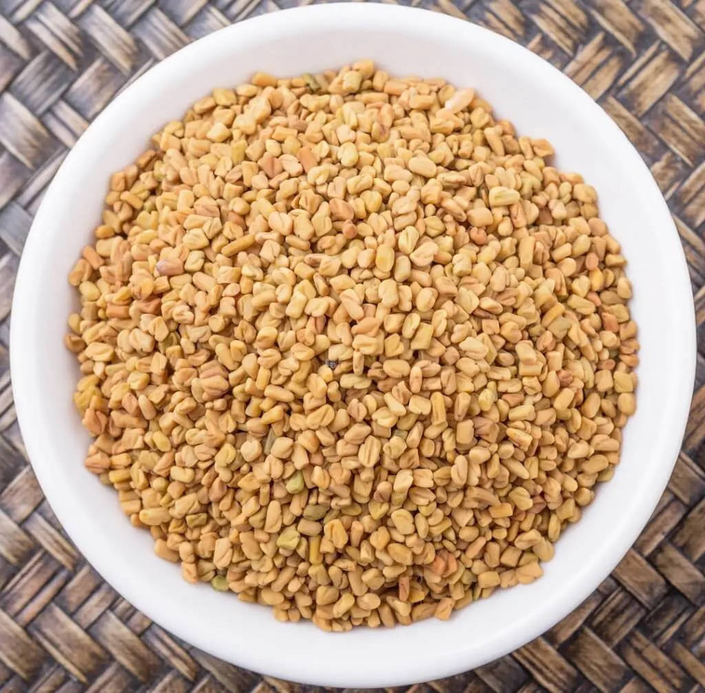 White Bowl Filled With Fenugreek Seeds Wallpaper