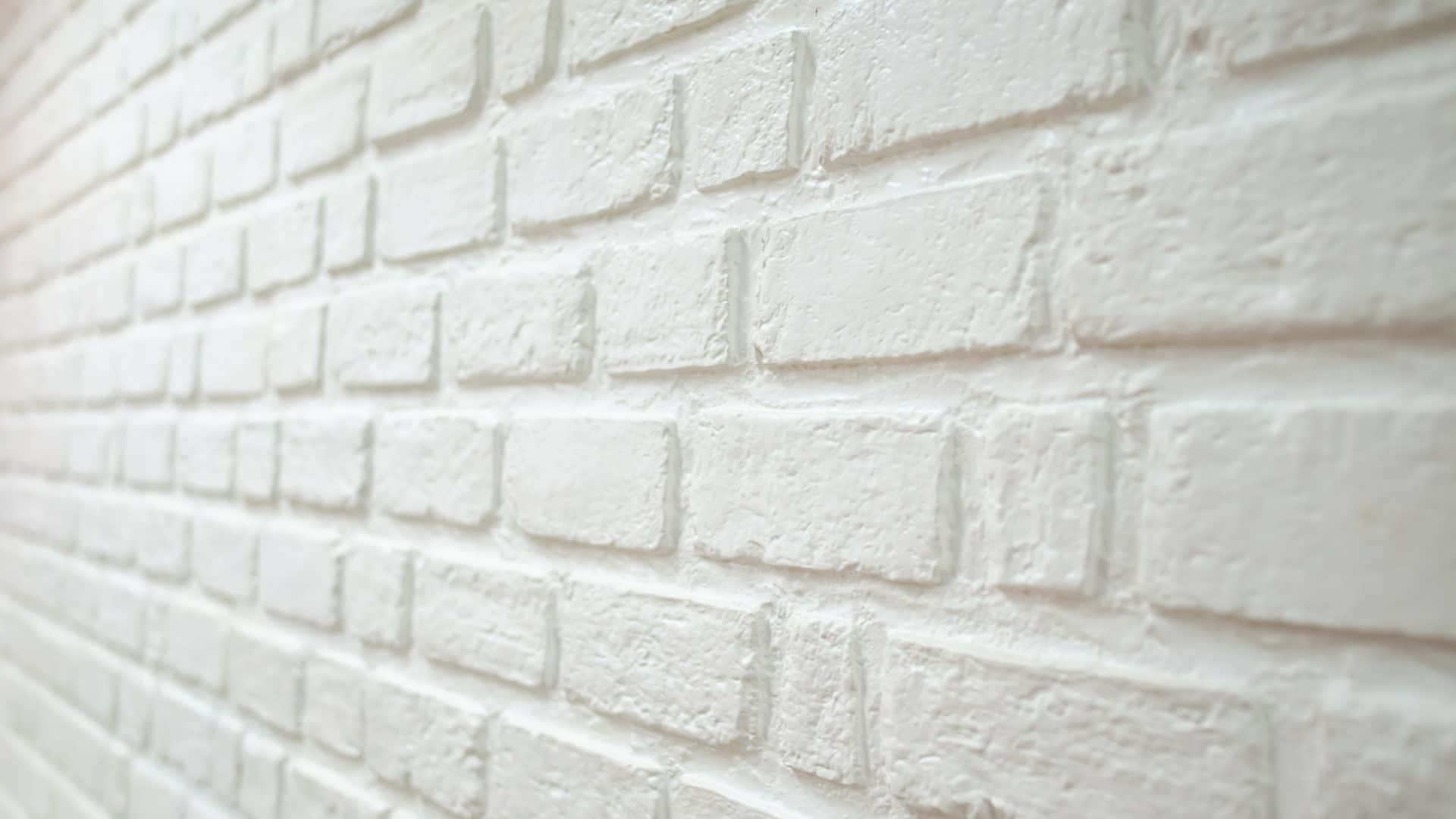 Hvid mursten væg med hvide malermærker
