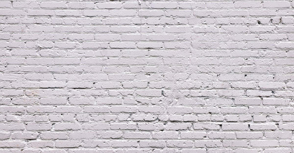 A white brick wall with a textured design.