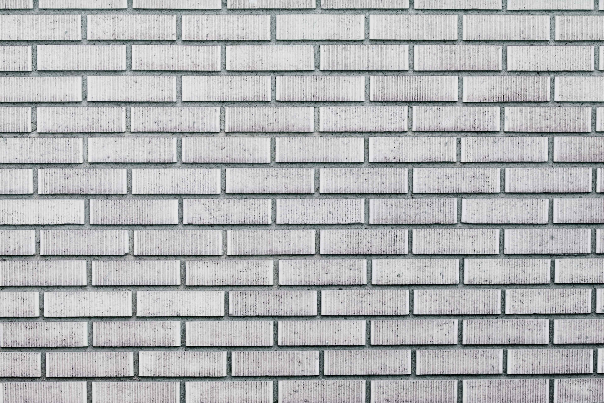 A white brick wall, providing a blank canvas for any design ideas