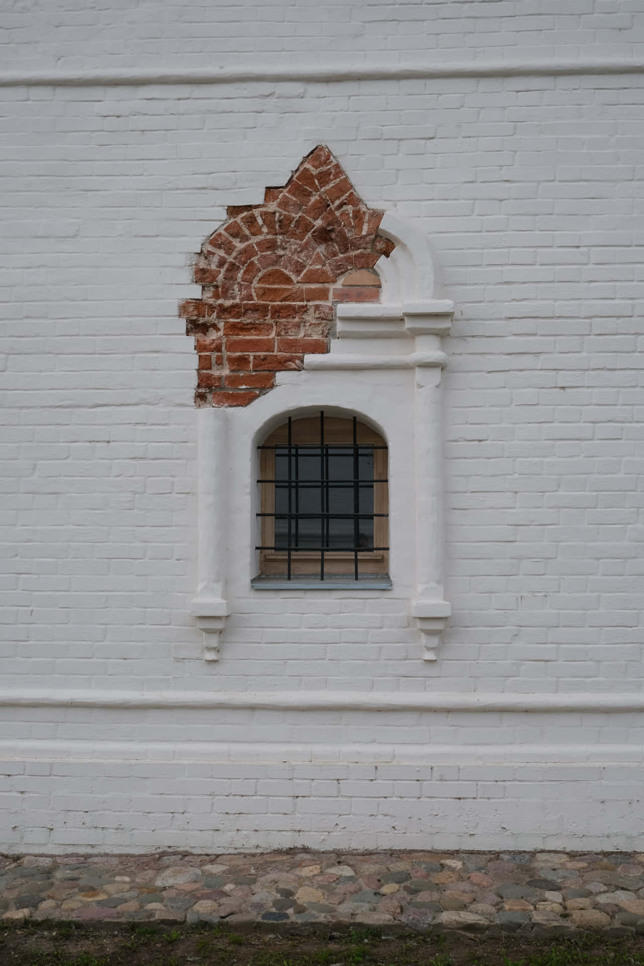 A Window With A Broken Window On A White Wall