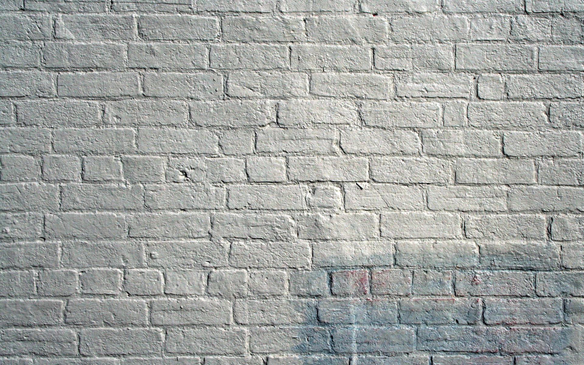 A Brick Wall With A Blue And White Paint