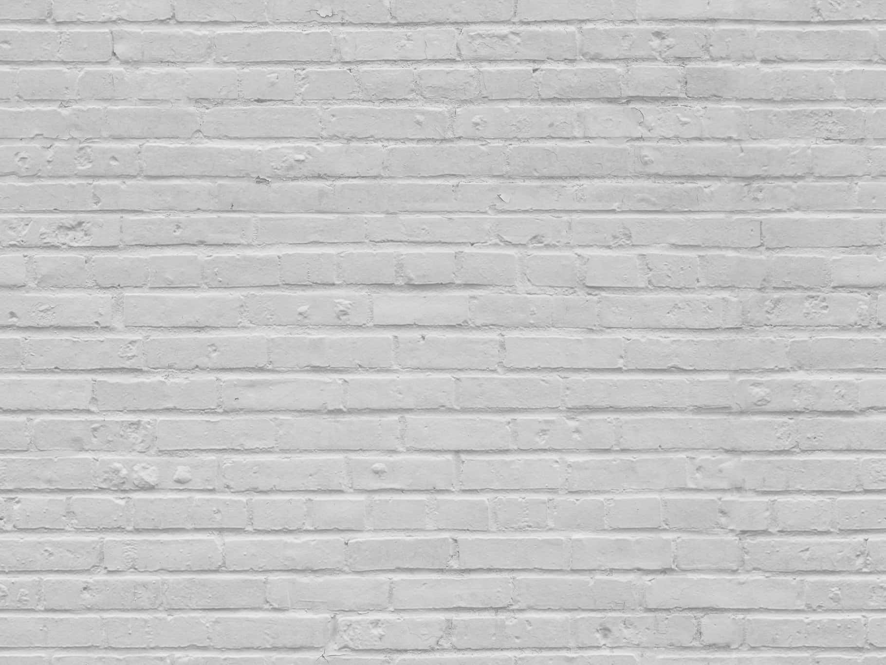 A striking white brick wall with detailed textures