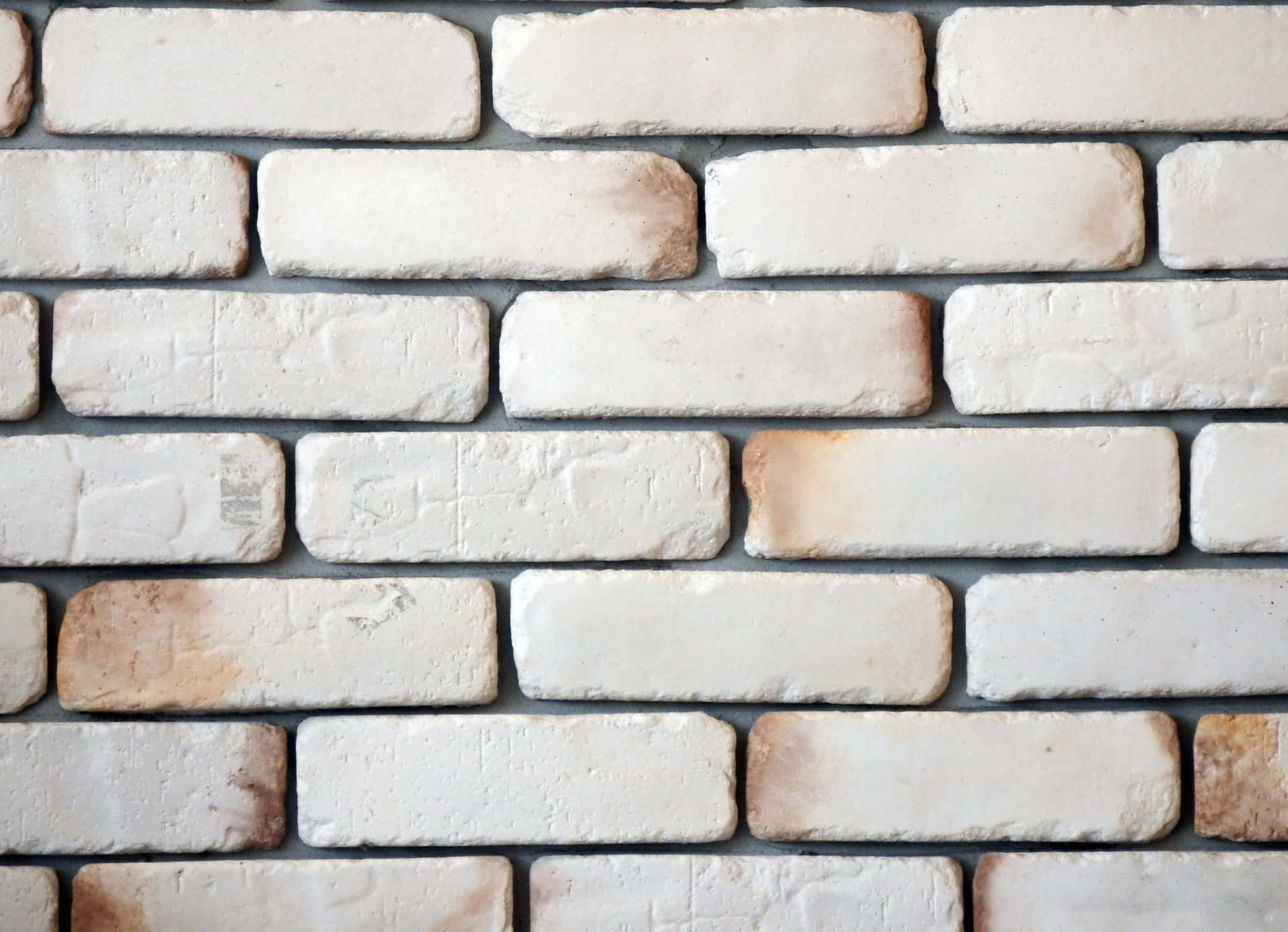 A White Brick Wall With A White Paint On It