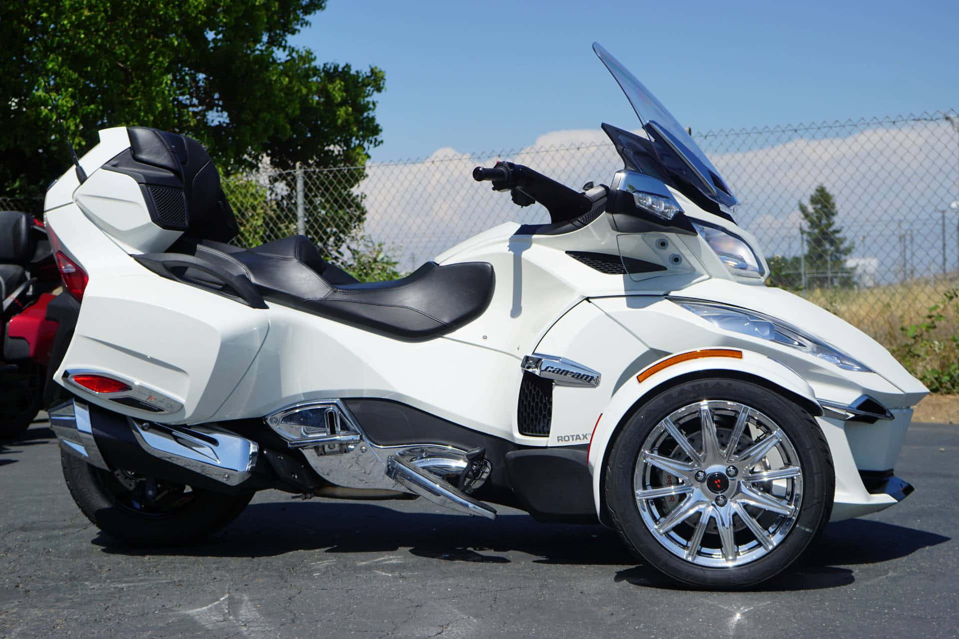 White Can Am Spyder Roadster Parked Outdoors Wallpaper
