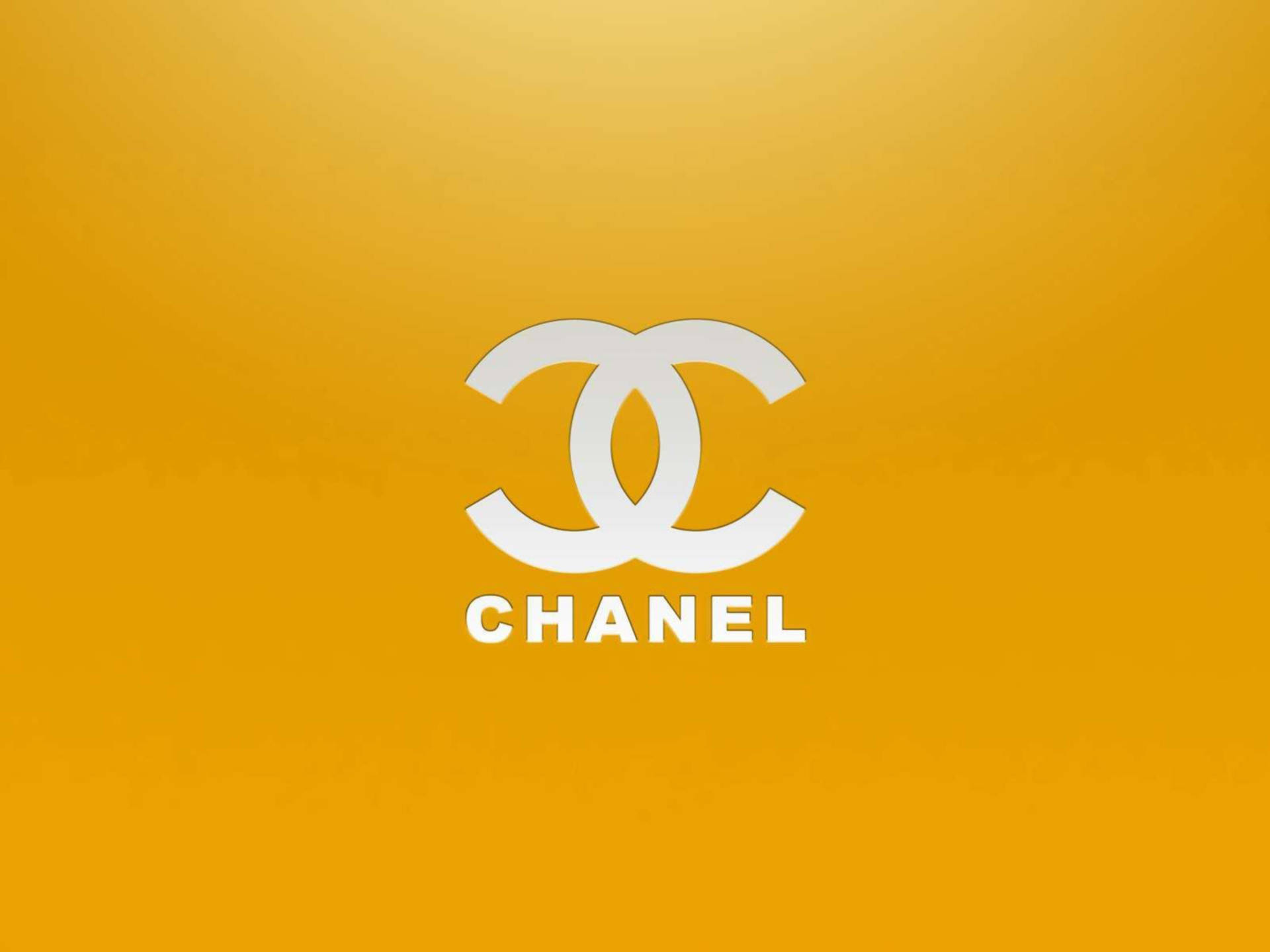 White Chanel Logo On Golden Yellow Wallpaper