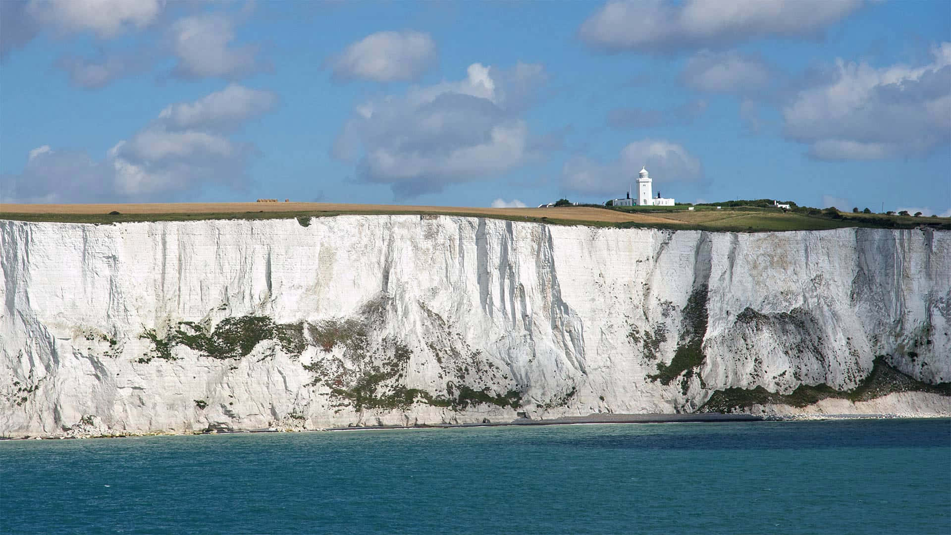 White Cliffs Of Dover Under The Cloudy Sky Wallpaper