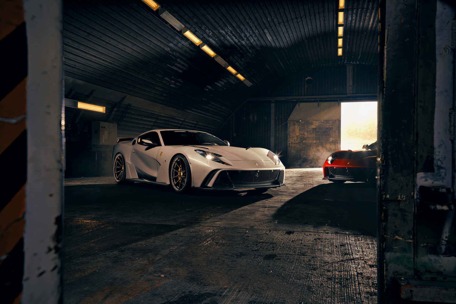 A White Sports Car Is Parked In A Garage Wallpaper