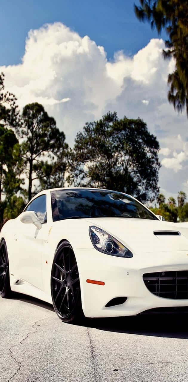 Power, speed and luxury in an elegant white Ferrari Wallpaper