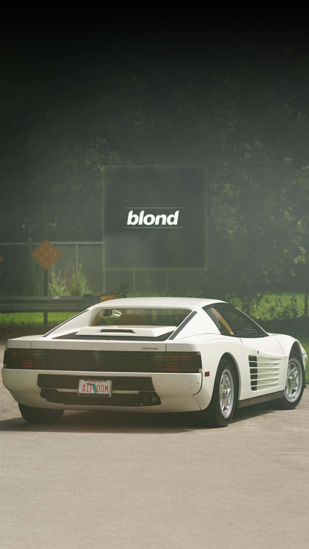 "Rev Up Your Style with a White Ferrari iPhone" Wallpaper