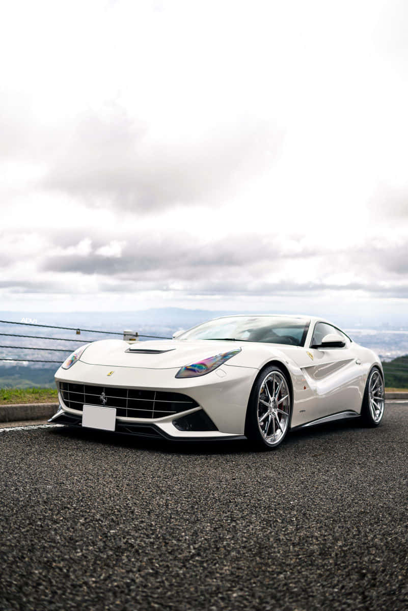 Feel the wind in your hair as you cruise down the highway in this sleek white Ferrari Wallpaper