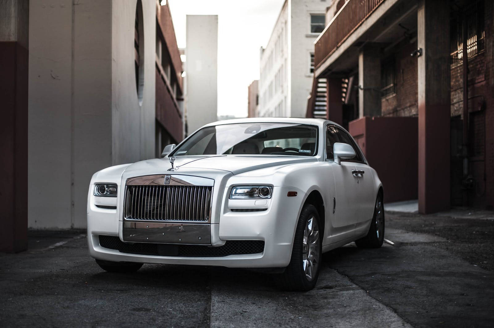 White Ghost Luxury Car Alley Shot Wallpaper