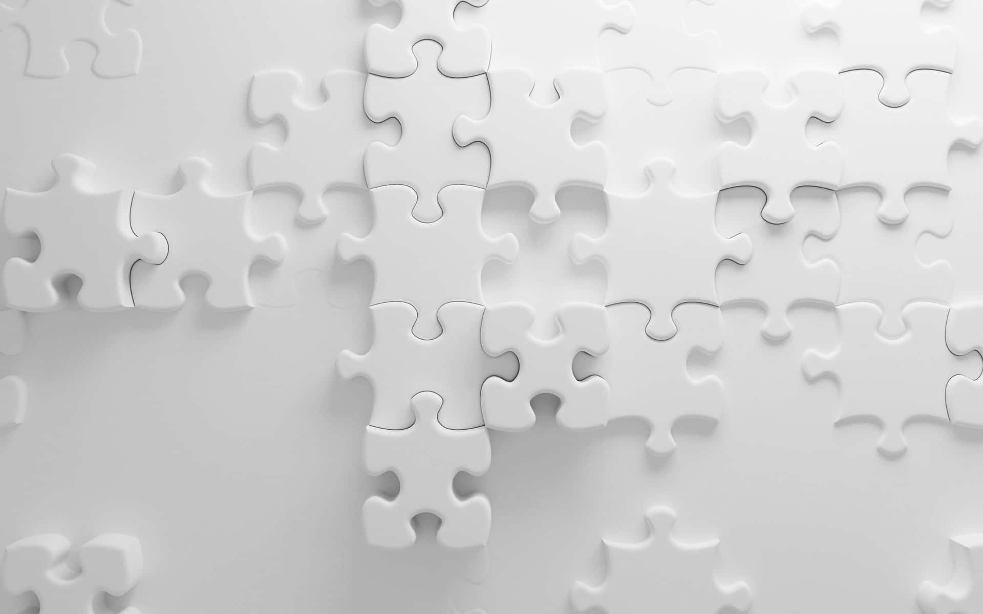 White Puzzle Pieces On A White Wall