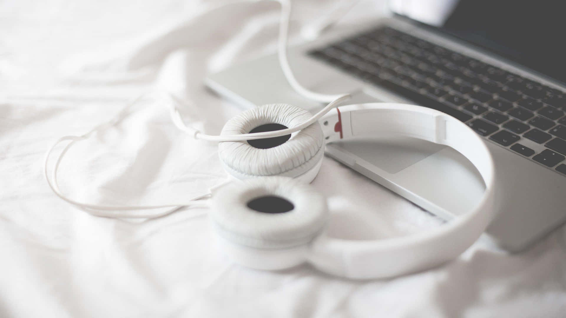 White Headphones Laptop Bedroom Setting Wallpaper