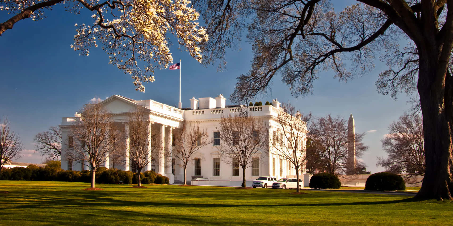 The White House Is In The Middle Of A Grassy Field