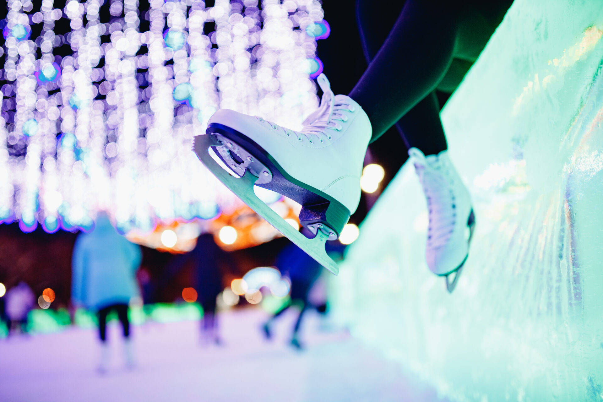 Caption: Grace on Ice: A Pair of White Ice Skating Shoes Wallpaper