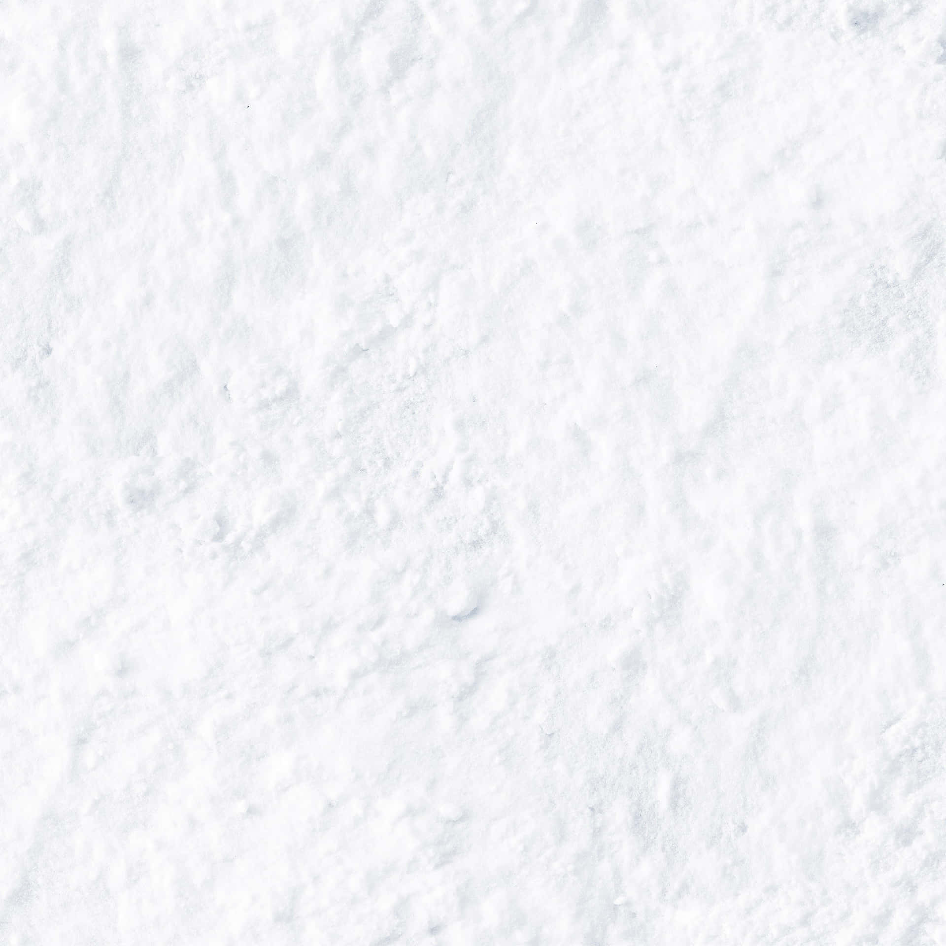 A White Snowy Background With A Snowflake Wallpaper