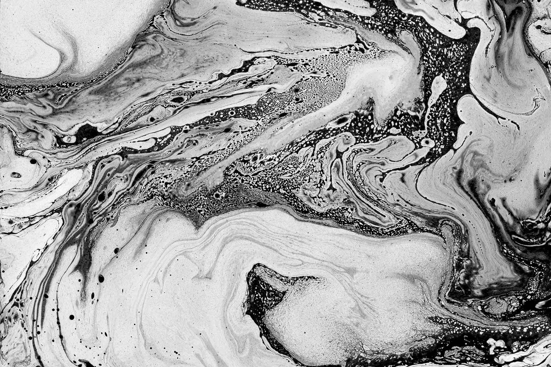A Black And White Photo Of A Swirling Liquid Wallpaper