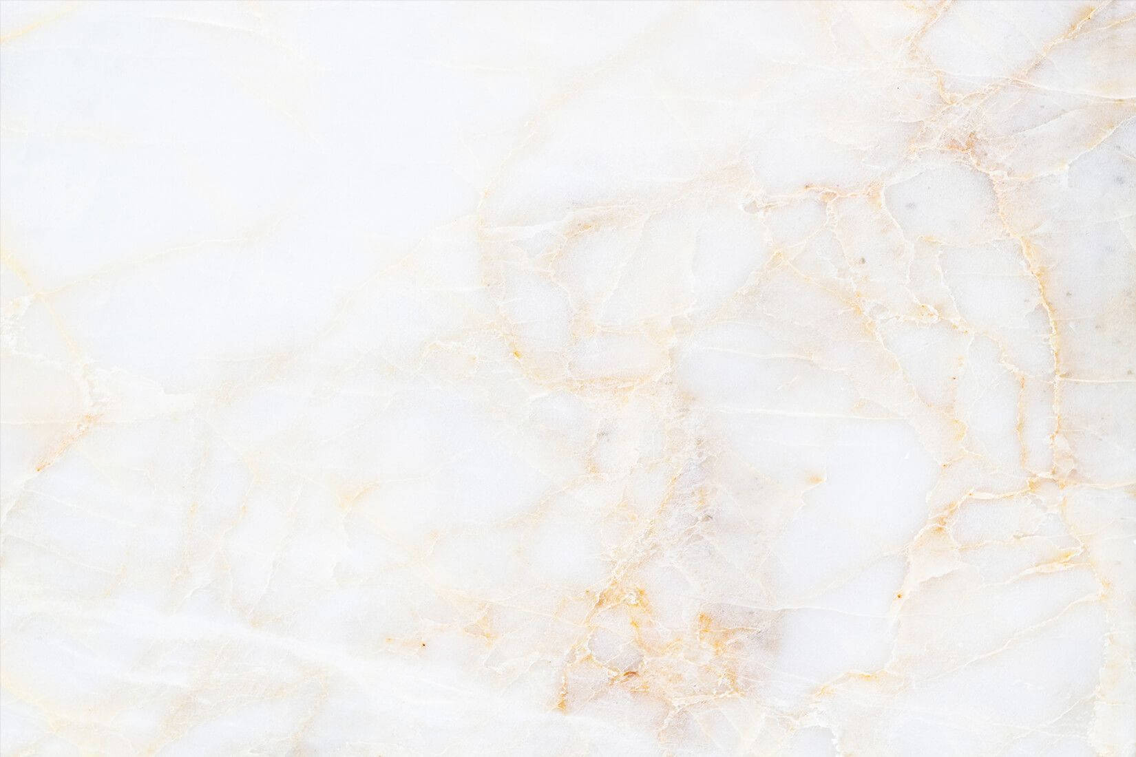 A White Marble Background With Gold And Yellow Wallpaper
