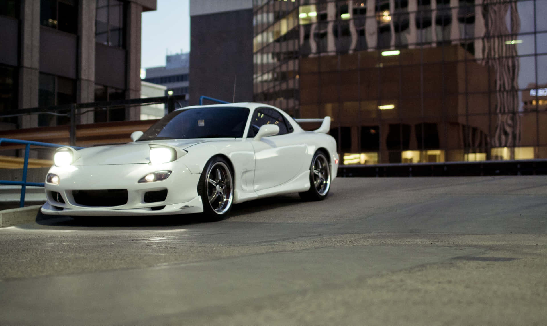 White Mazda Rx 7 In Front Of Building Wallpaper