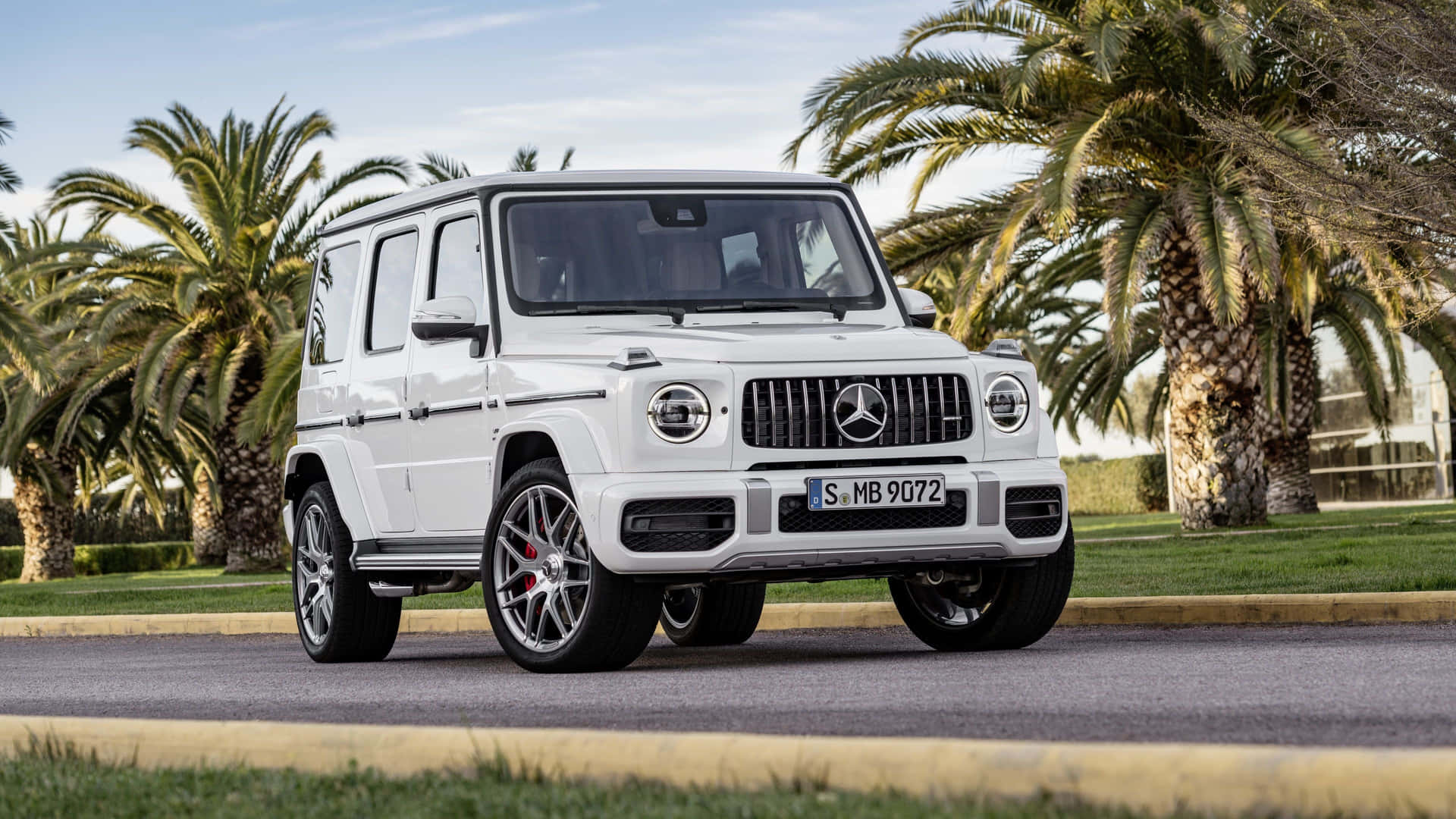 White Mercedes Benz G Wagon Parked Outdoors.jpg Wallpaper