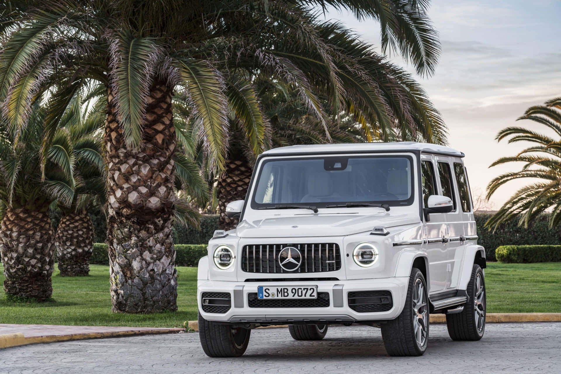 White Mercedes Benz G Wagon Parked Outdoors Wallpaper