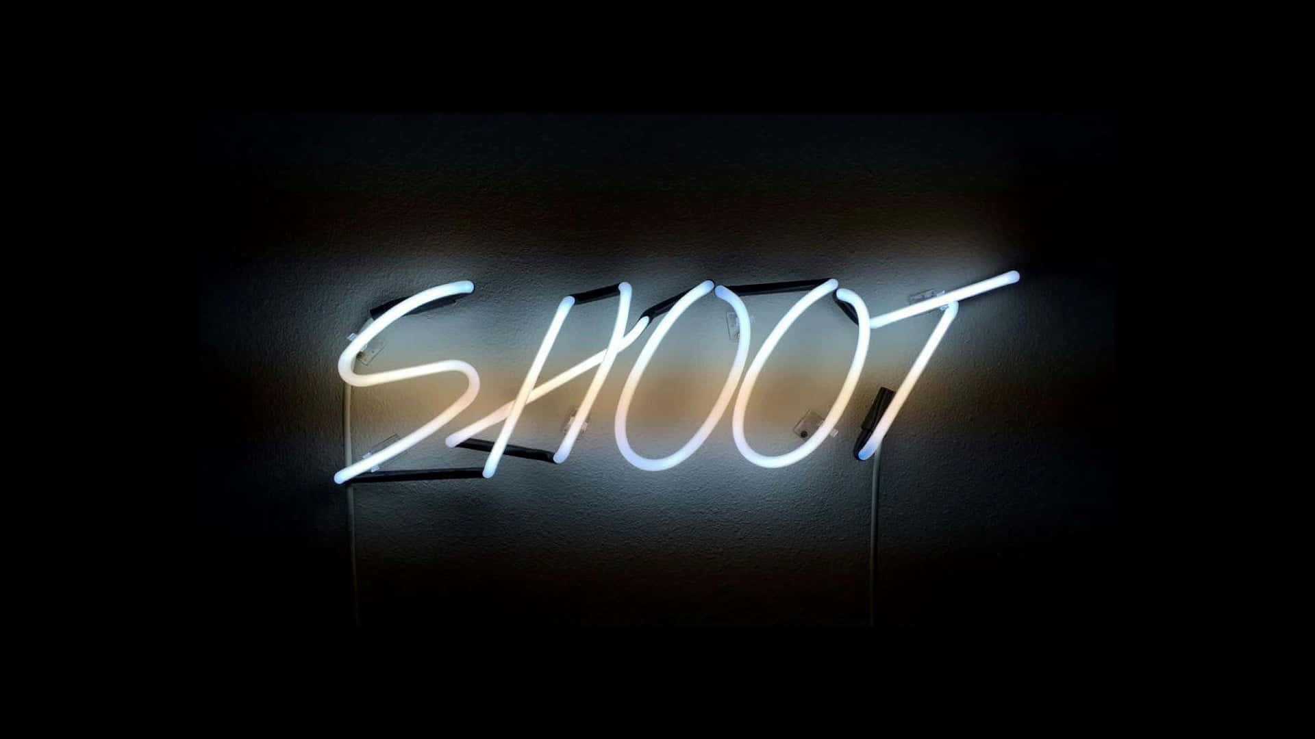 A Neon Sign With The Word Shoot On It Wallpaper