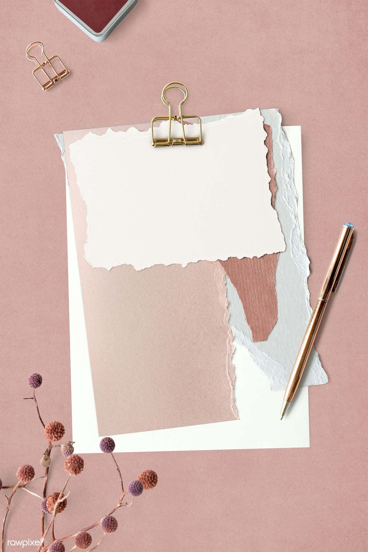 A Pink Paper Clip And A Pen On A Pink Background