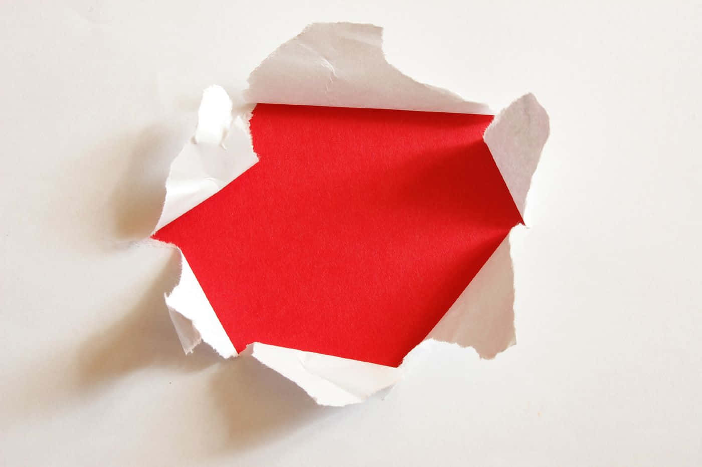 A Red And White Paper Cut Out Of A Sheet Of Paper