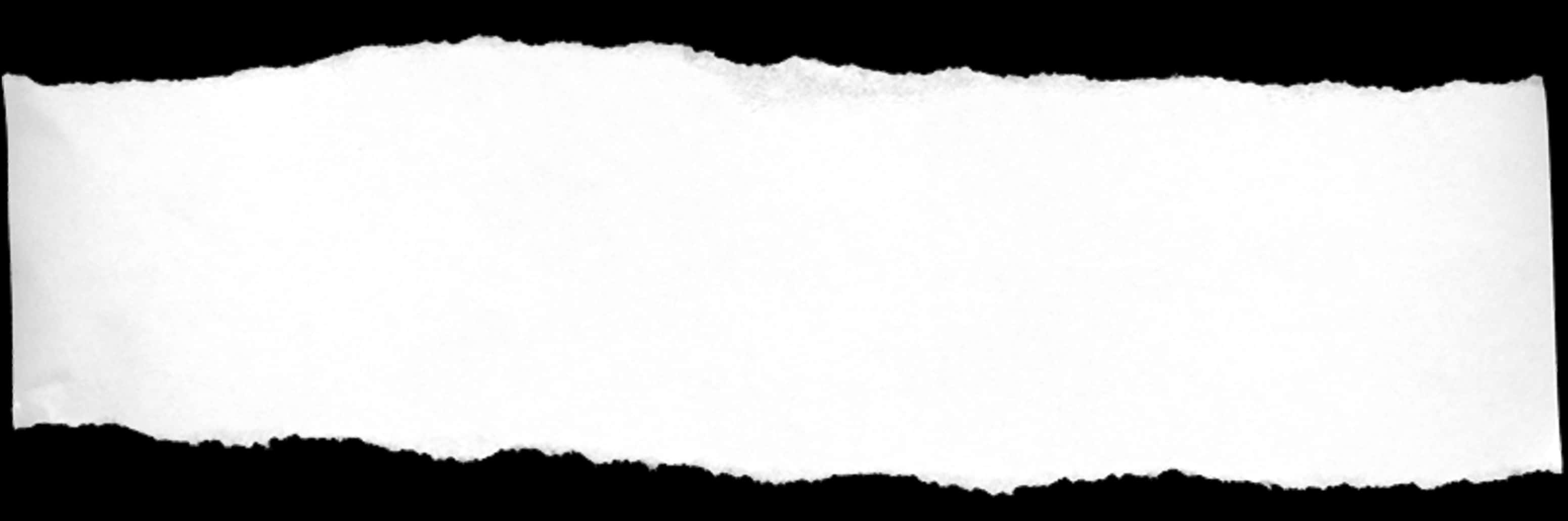 A White Piece Of Paper On A Black Background