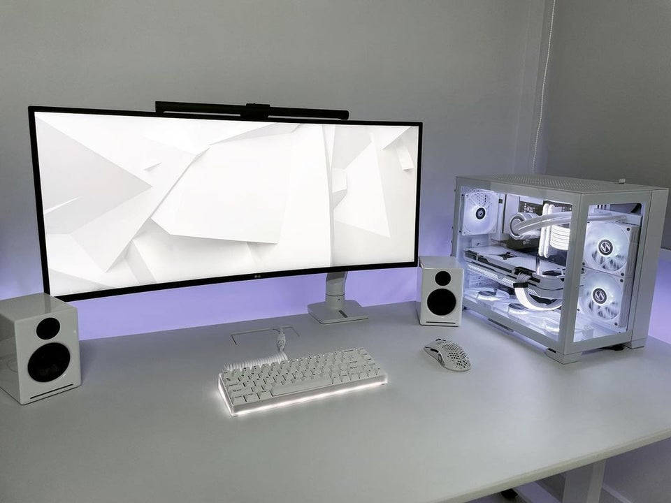 Technology at Its Best: White PC with Blazing Speed Wallpaper