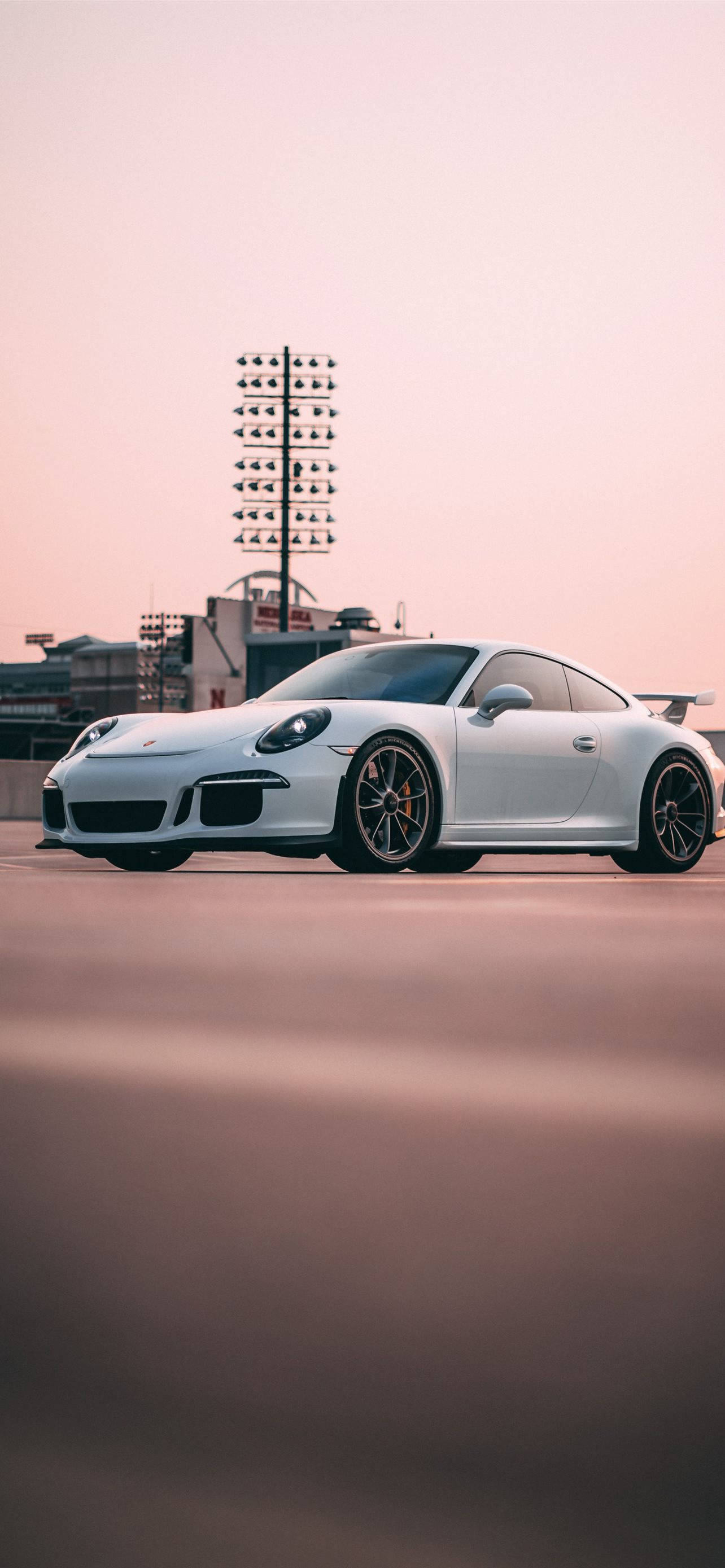 White Porsche 911 In Outdoor Parking Wallpaper