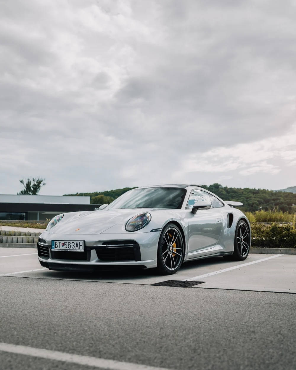 White Porsche 911 In Outdoor Parking Wallpaper