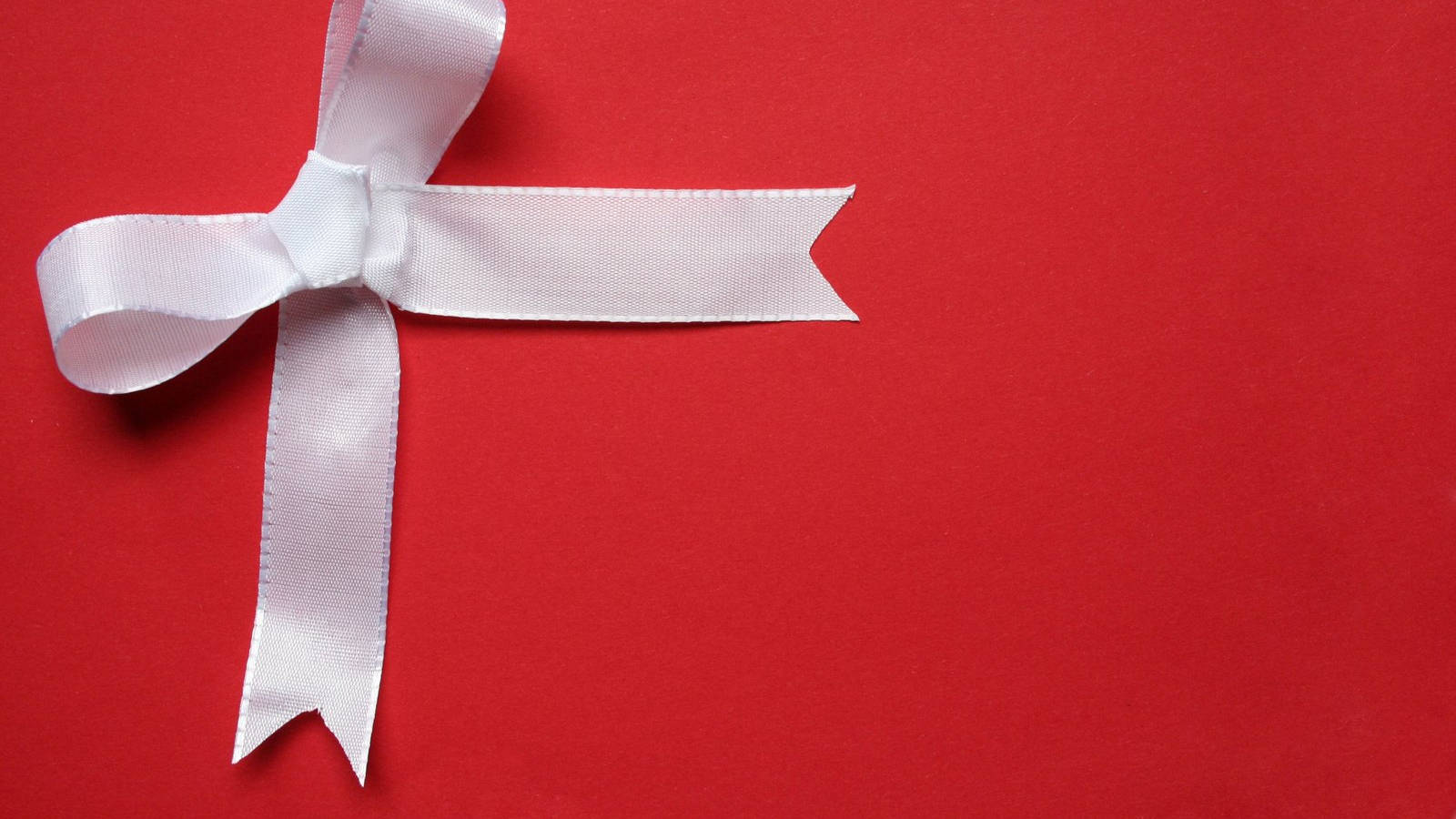White Ribbon On Red Christmas Background