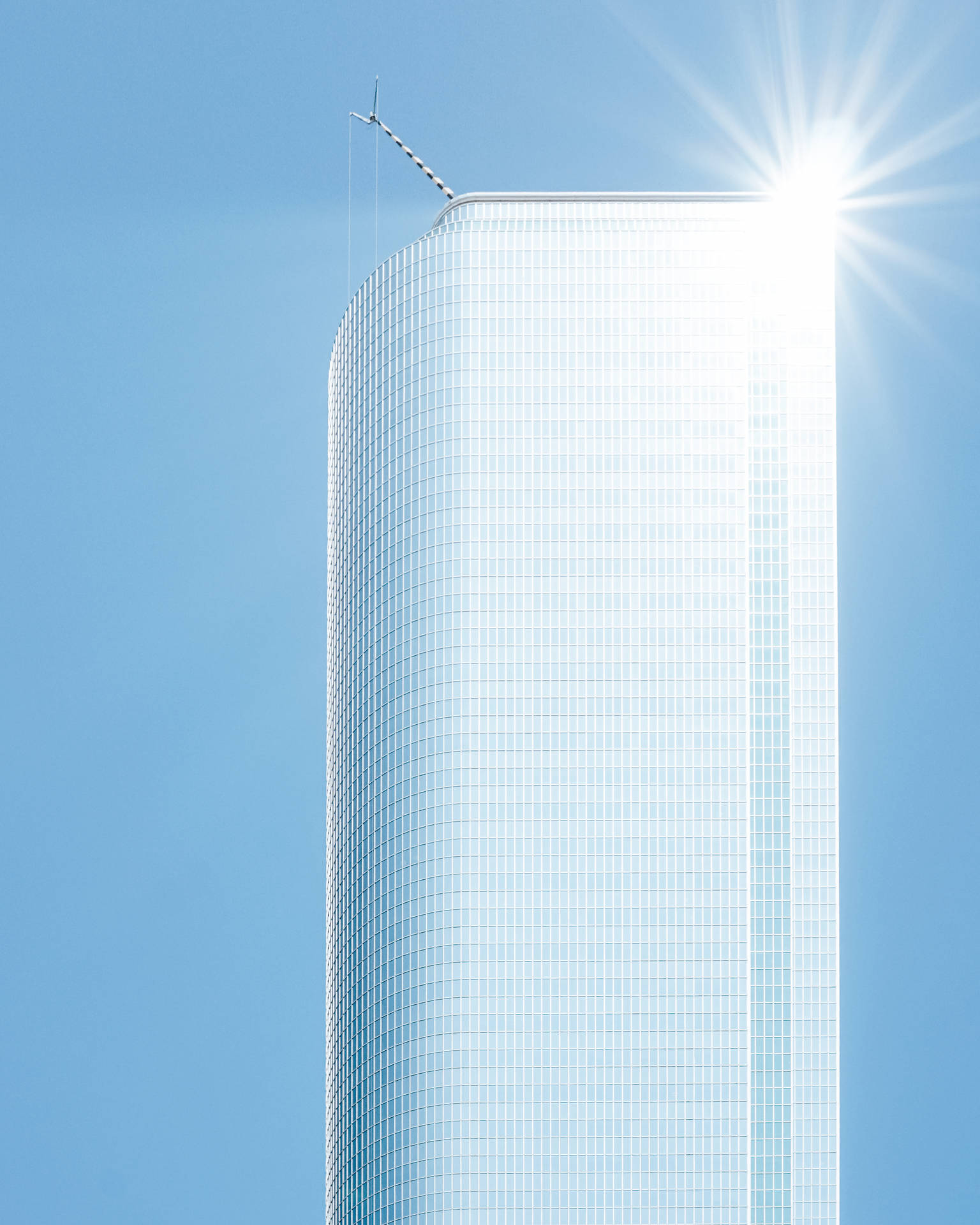 White Skyscraper With Blue Sky Wallpaper