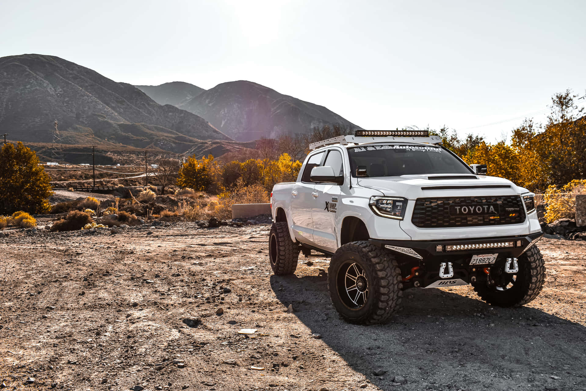 White Tundra With Large Tires Wallpaper