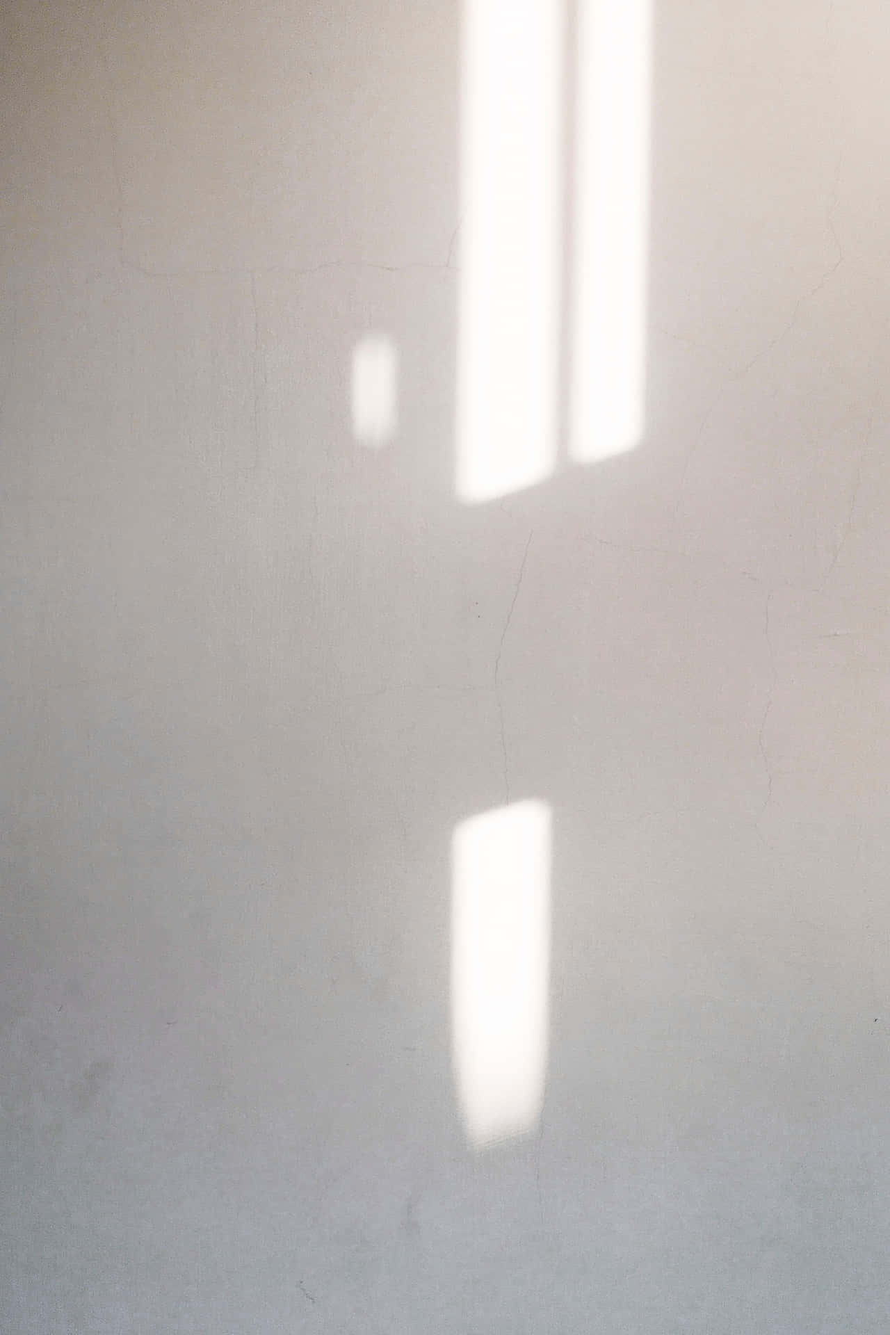 White Wall Background With Sunlight Pattern