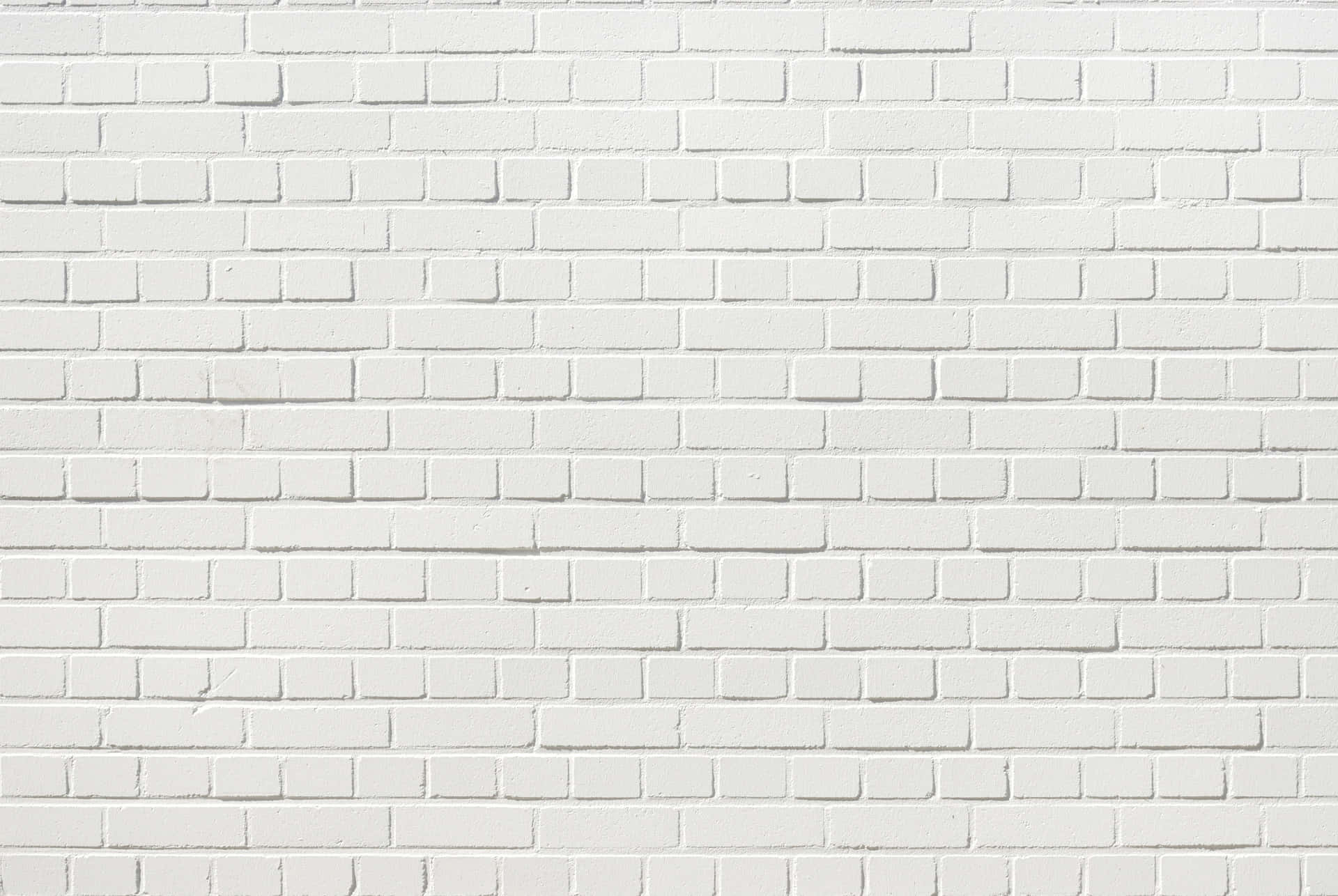 White Wall Background With A Defined Brick Pattern
