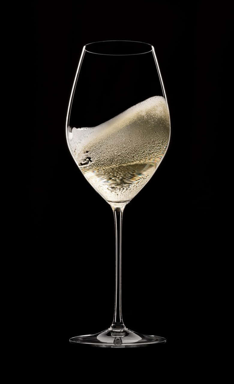 A glass of white wine to toast a special moment Wallpaper